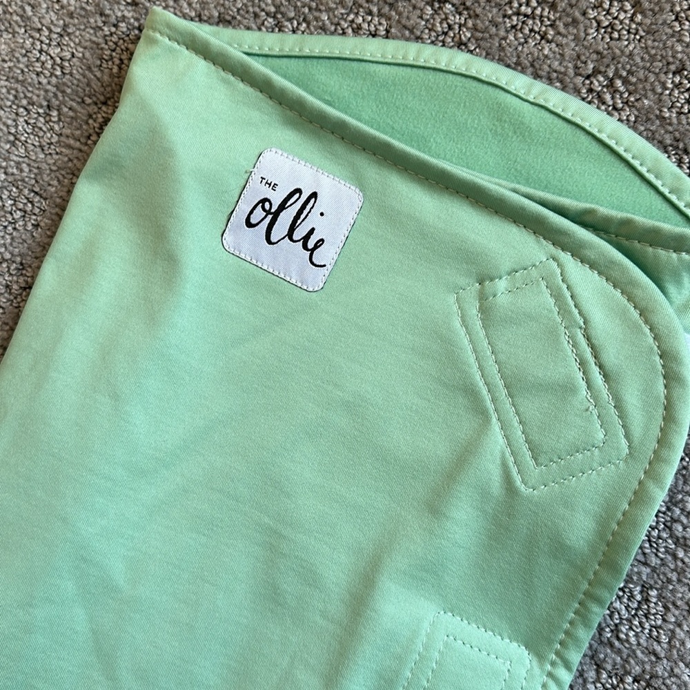 The Ollie World Swaddle in Meadow. Like new - used one time.